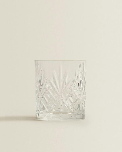 CRYSTALLINE TUMBLER WITH RAISED DESIGN