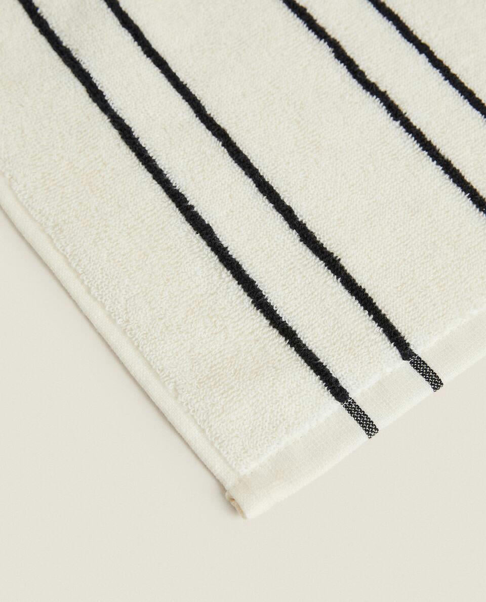 TOWEL WITH IRREGULAR STRIPE DETAIL